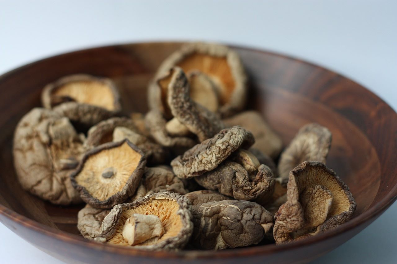 Dried shiitake mushrooms in a wooden bowl