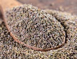 Parsley seeds in a wooden spoon